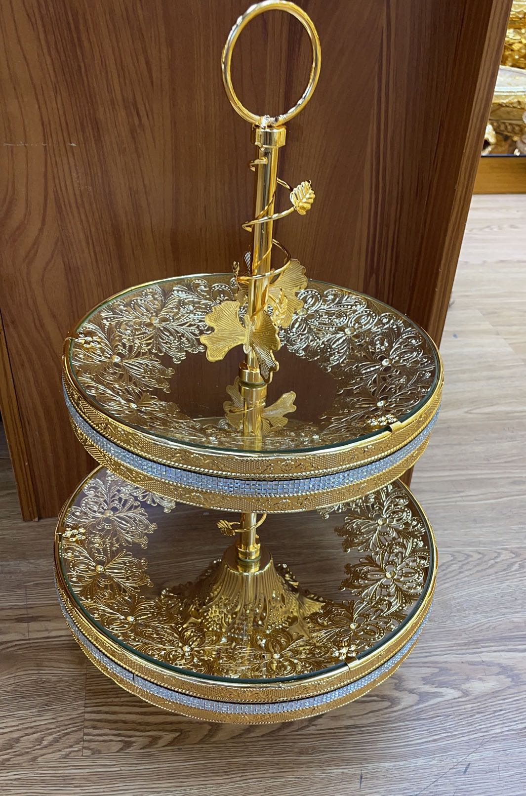 A glass fruit plate with wrought iron