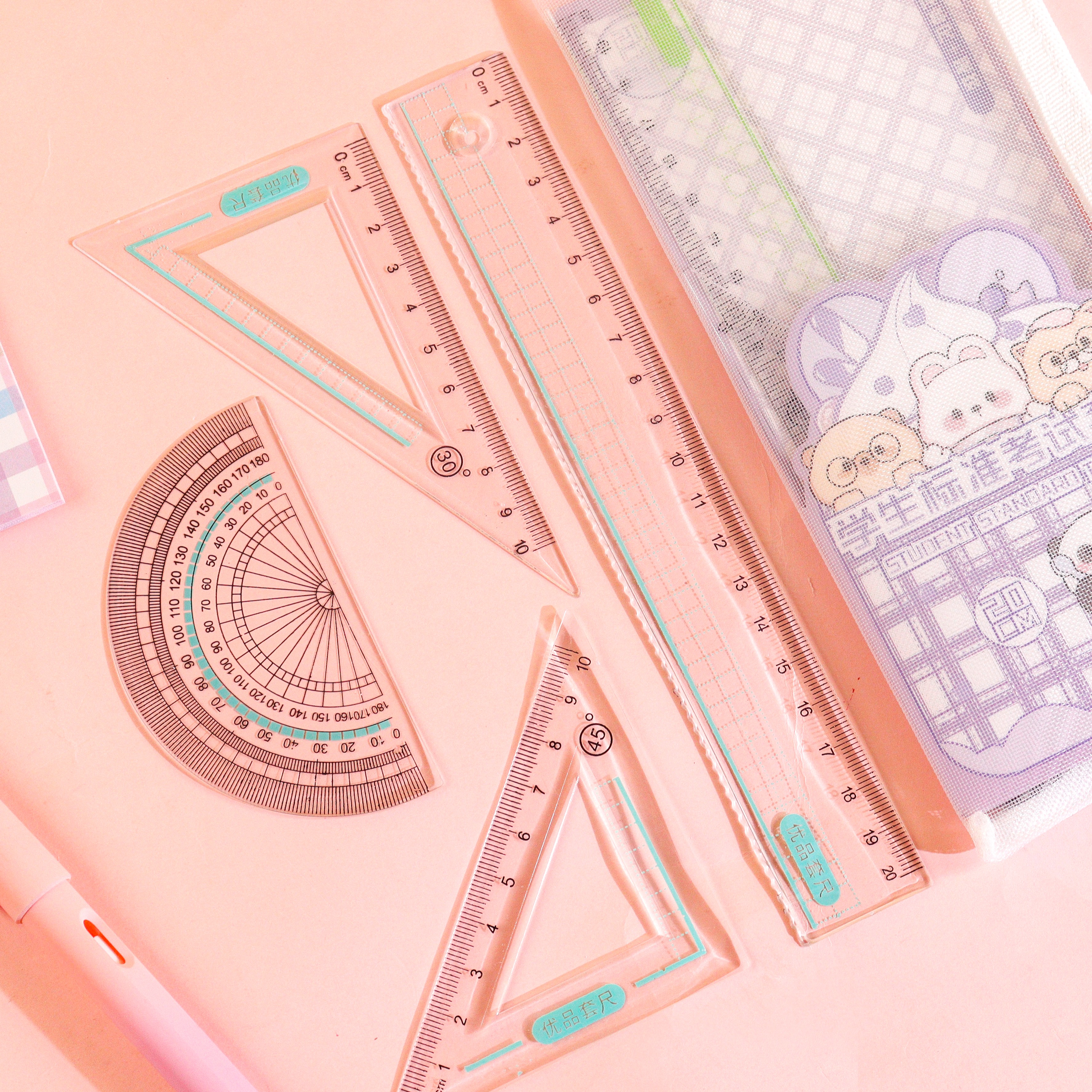 XX-0016 Multi-functional grid bag 4-piece set, essential tool for learning, high school, primary school and junior high school students cartoon pattern high transparency ruler set Item Picture