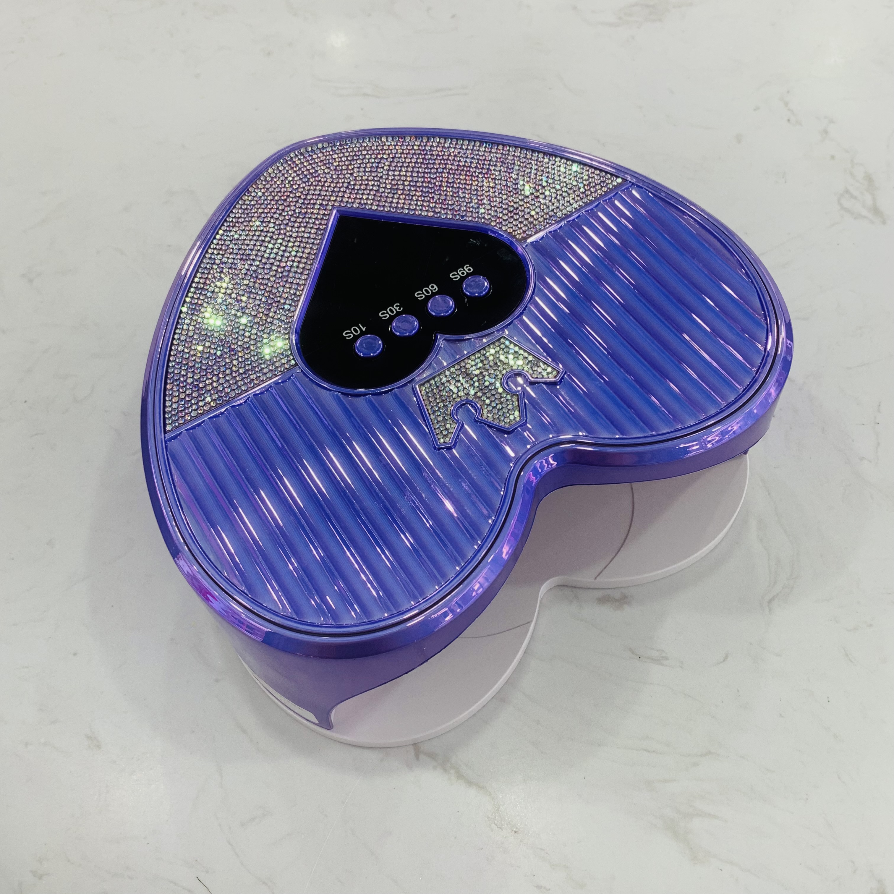 The new 288W high-power heart-shaped nail polish lamp features an intelligent sensor with 45 lamp beads and 4 timer Settings. The nail polish glue dries quickly without blackening your hands details Picture