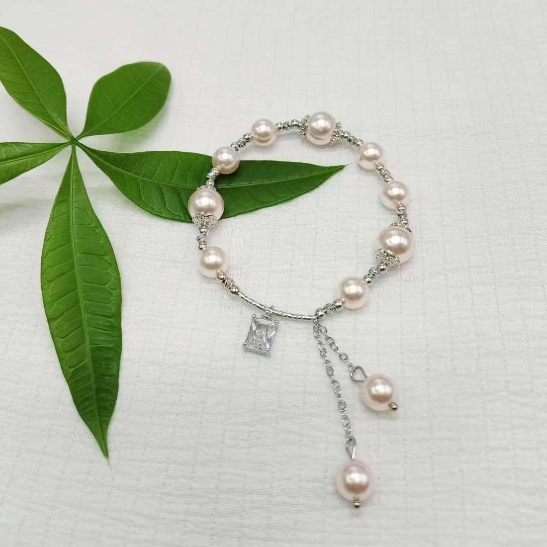 The Shijia pearl copper Bead Square Zircon bracelet features a high-end, mass-market, and light luxury design. It is a popular online hit with copper tube tassel ornaments detail image 9
