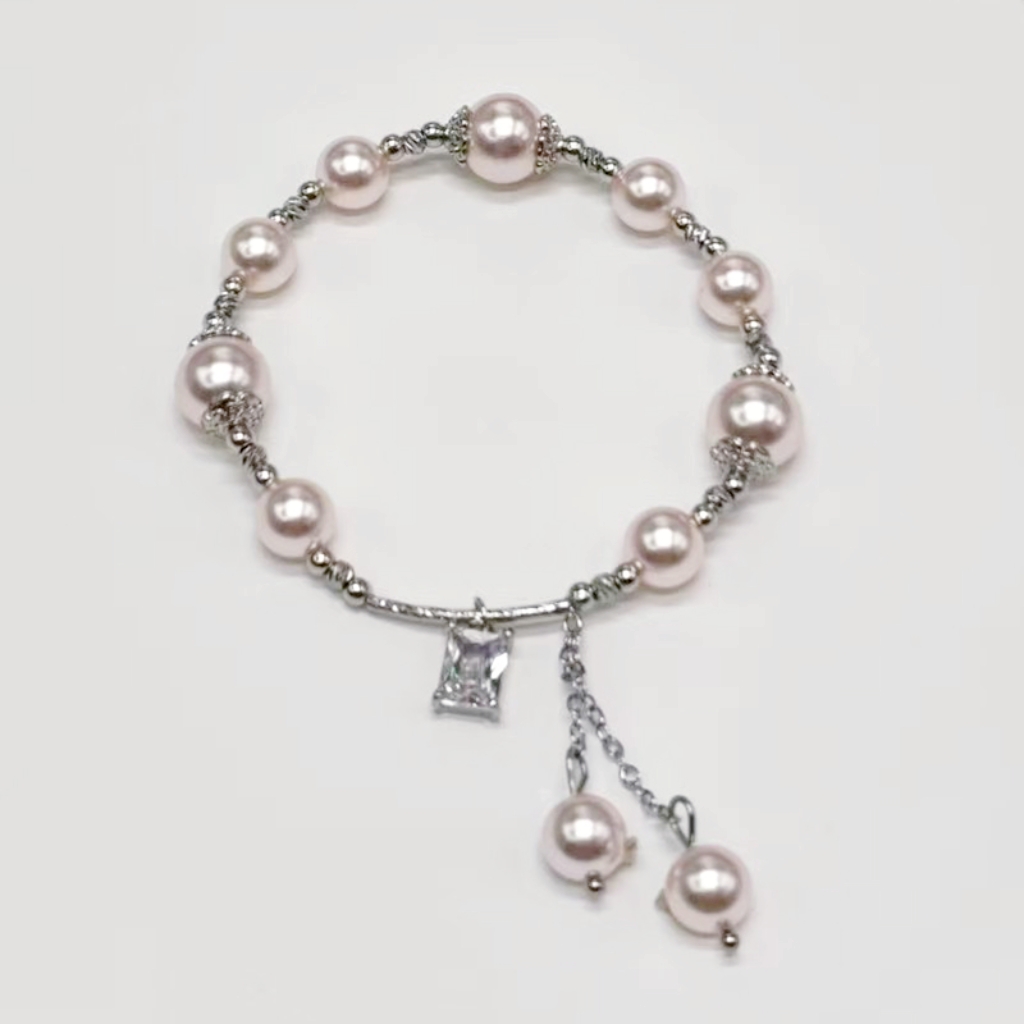 The Shijia pearl copper Bead Square Zircon bracelet features a high-end, mass-market, and light luxury design. It is a popular online hit with copper tube tassel ornaments detail image 3