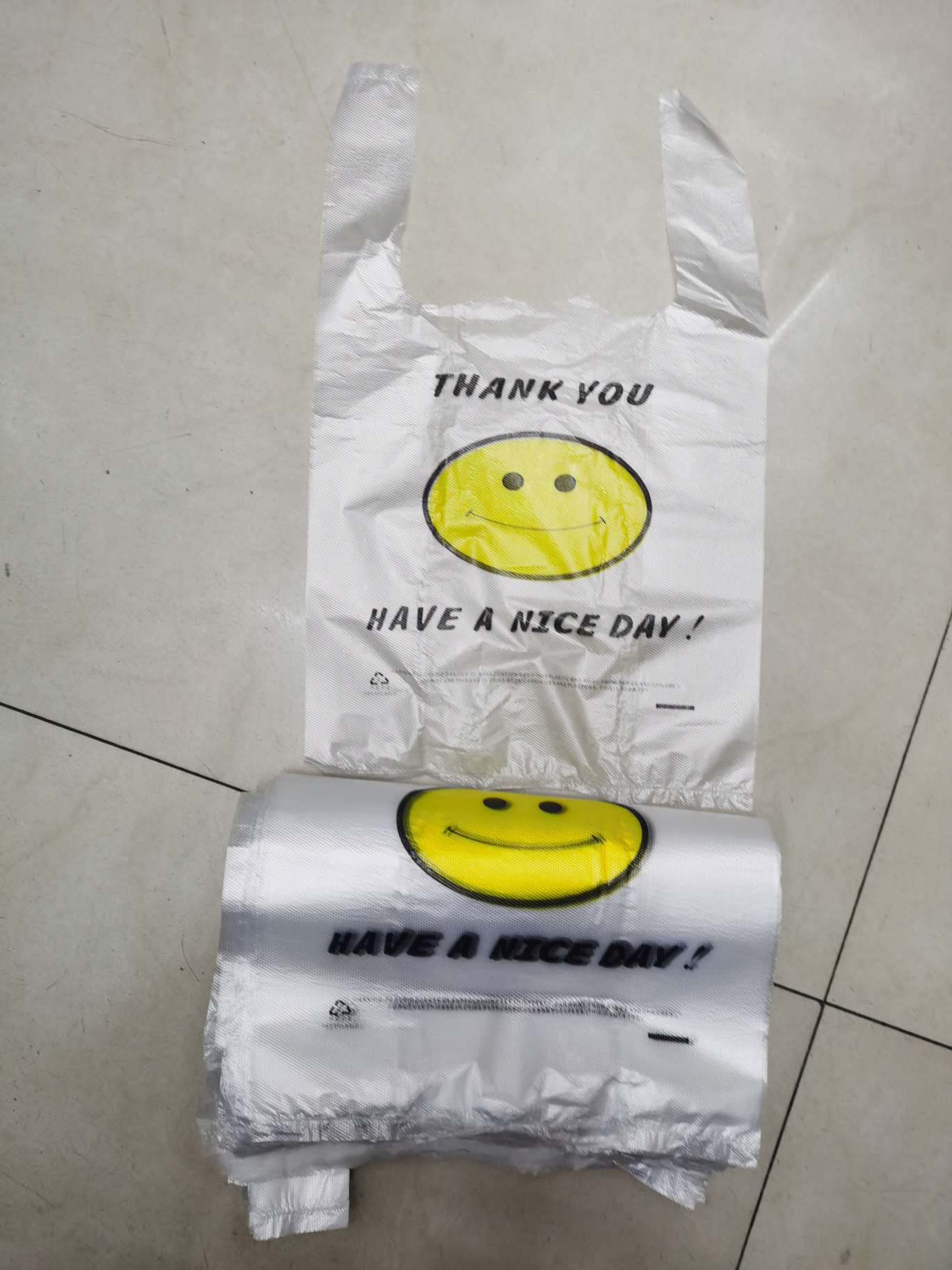 Cute yellow smiling face, disposable thickened vest bag, packing bag, plastic bag