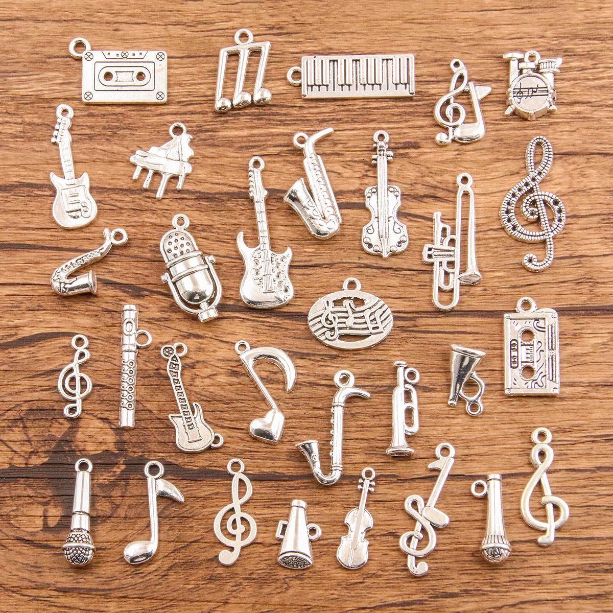 34 cross-border musical note pendant piano guitar microphone speaker suona horn music equipment alloy decoration accessories