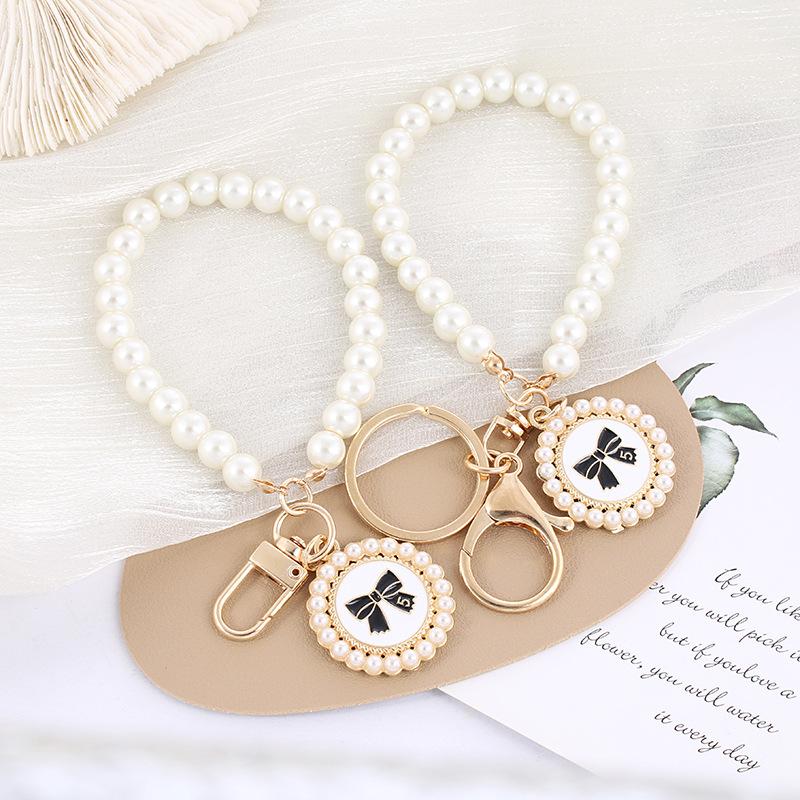 creative pearl round bow keychain pendant car pearl key chain ring couple bags pendant accessories