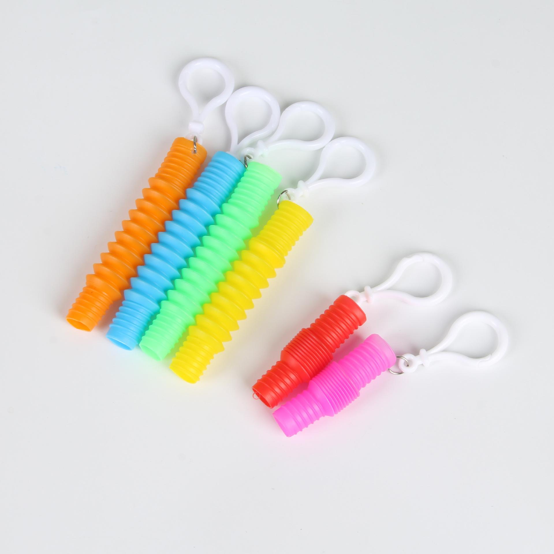 cross-border new exotic color sensory creative tpr water pipe keychain decompression pull decompression toy water pipe wholesale