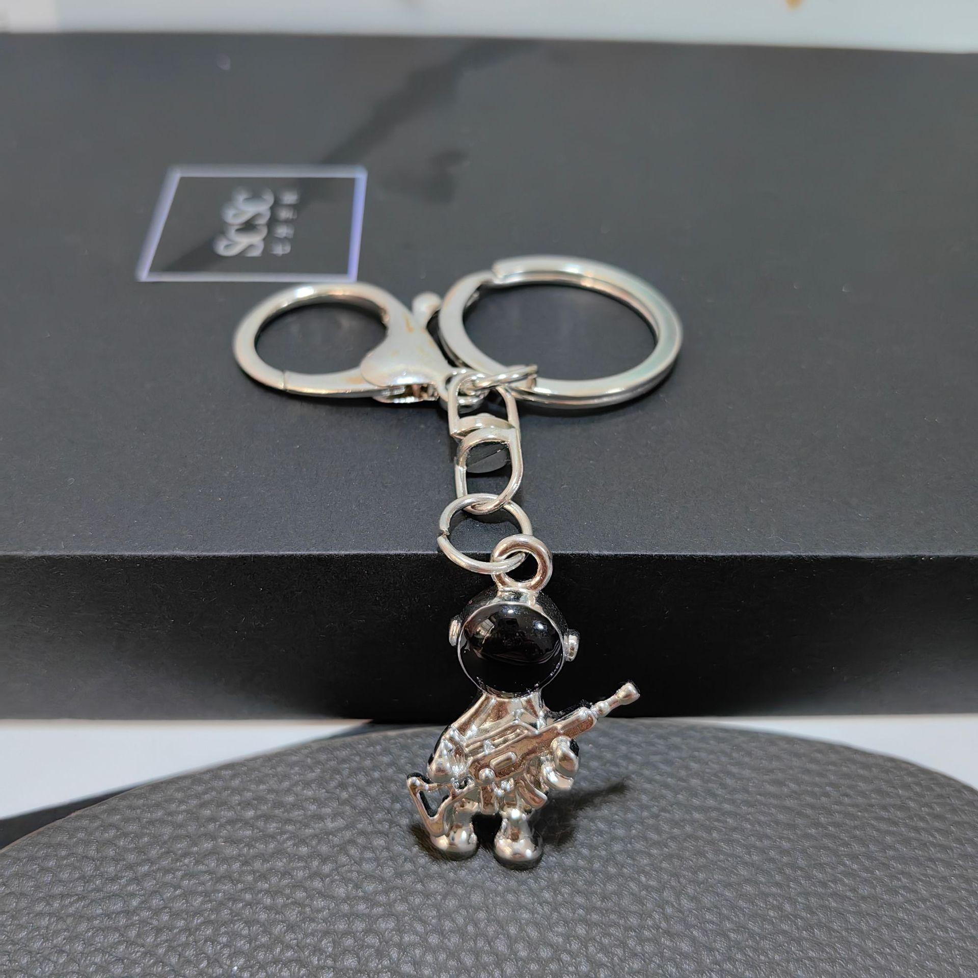 Cross-Border Cute Three-Dimensional Space Astronaut Keychain Internet Celebrity Cartoon Gun Spaceman Bag Jewelry Pendant