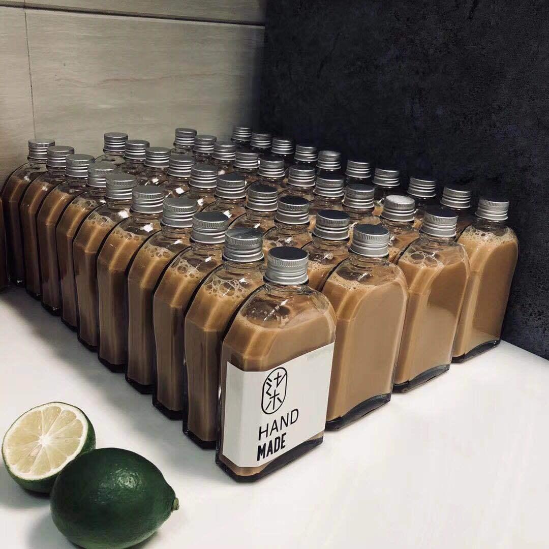 wholesale transparent glass jar beverage bottle cold extraction bottle flat liquor bottle cold drink milk tea light cut-off sealed aluminum cover fire extinguisher bottles