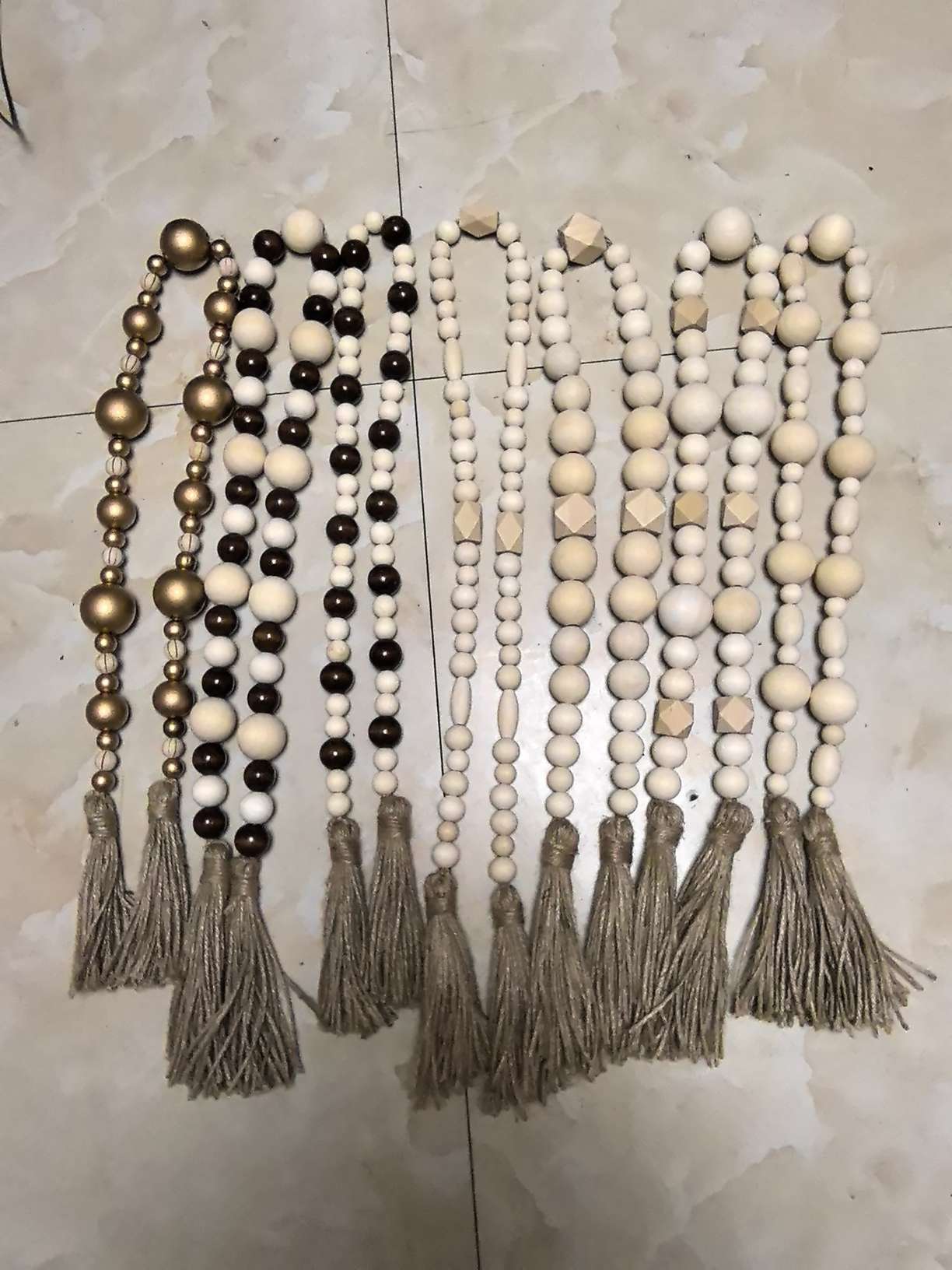Wooden bead strings can be used to hang vases for decoration details Picture