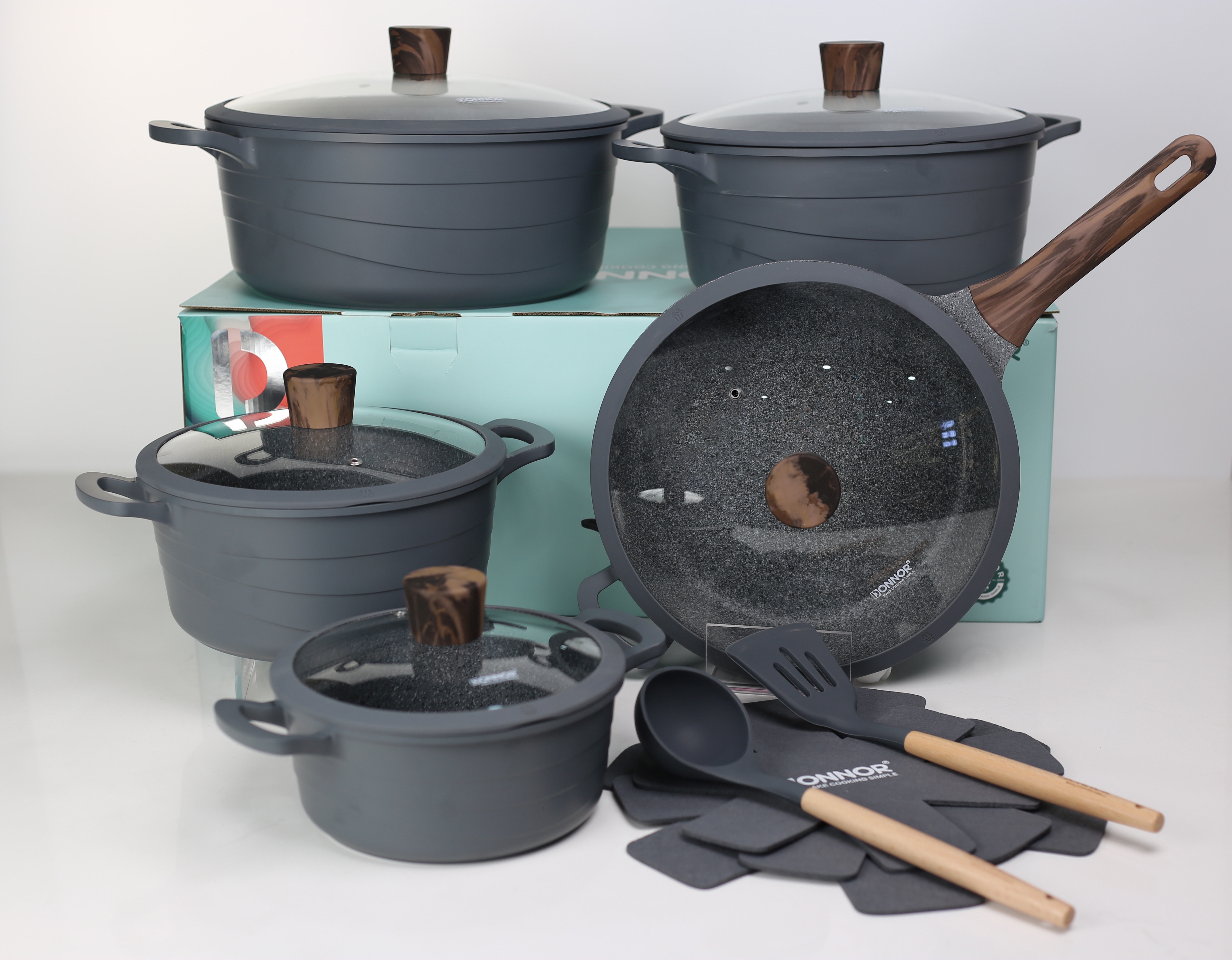 Wave Series 15-piece set: 20/24/28/32 soup pot, 28 deep frying pan, 3 silicone LIDS, 2 pot pads, 2 rubber spatulas, silicone LIDS covering the bottom, stacked with 5 layers of silver embossed color box, black, gray, ivory white details Picture