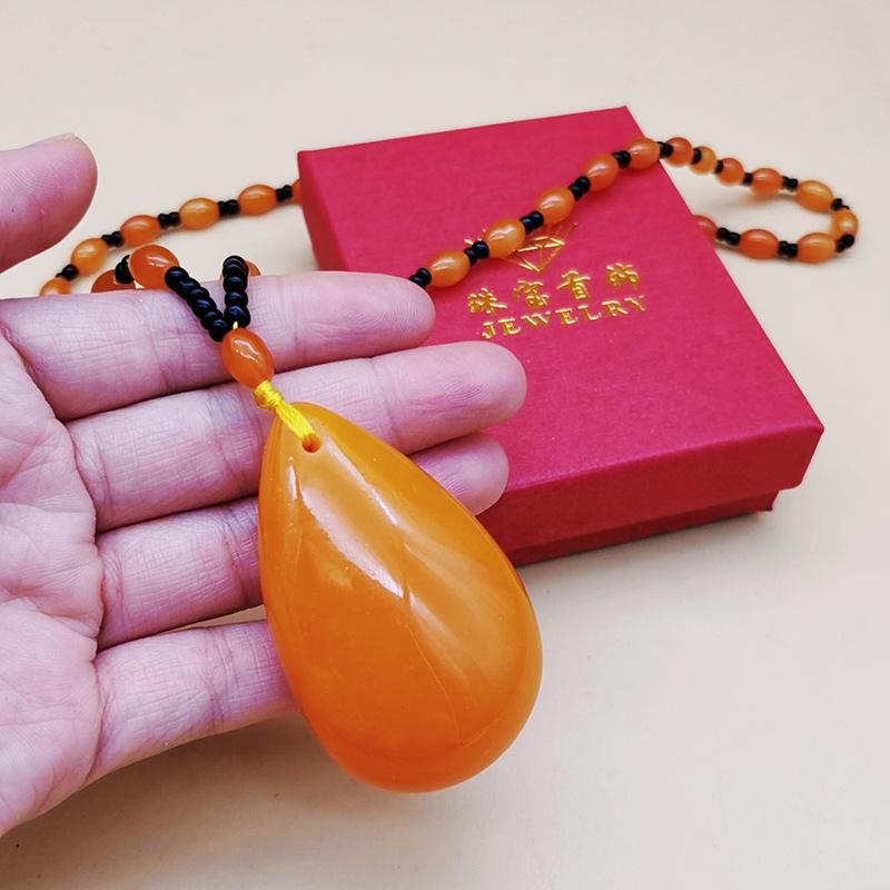 second generation orange beeswax necklace water drop pendant sweater chain live broadcast gift artistic retro yellow chicken grease amber pendant Application Scenario