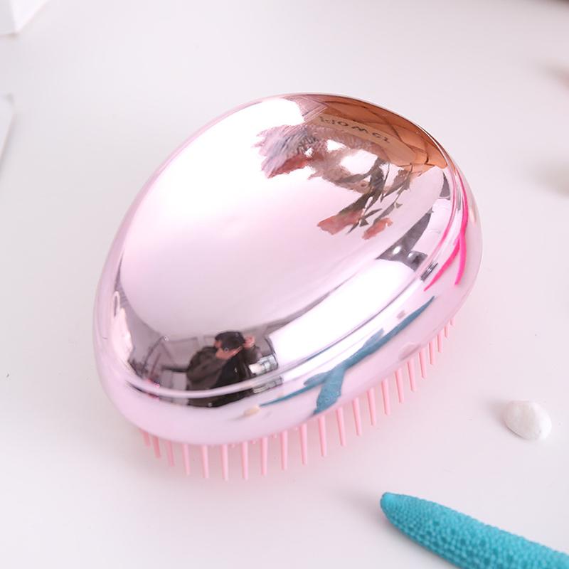 electroplated abs beauty hair comb brightening powder golden massage hair care comb glossy plastic egg comb details Picture