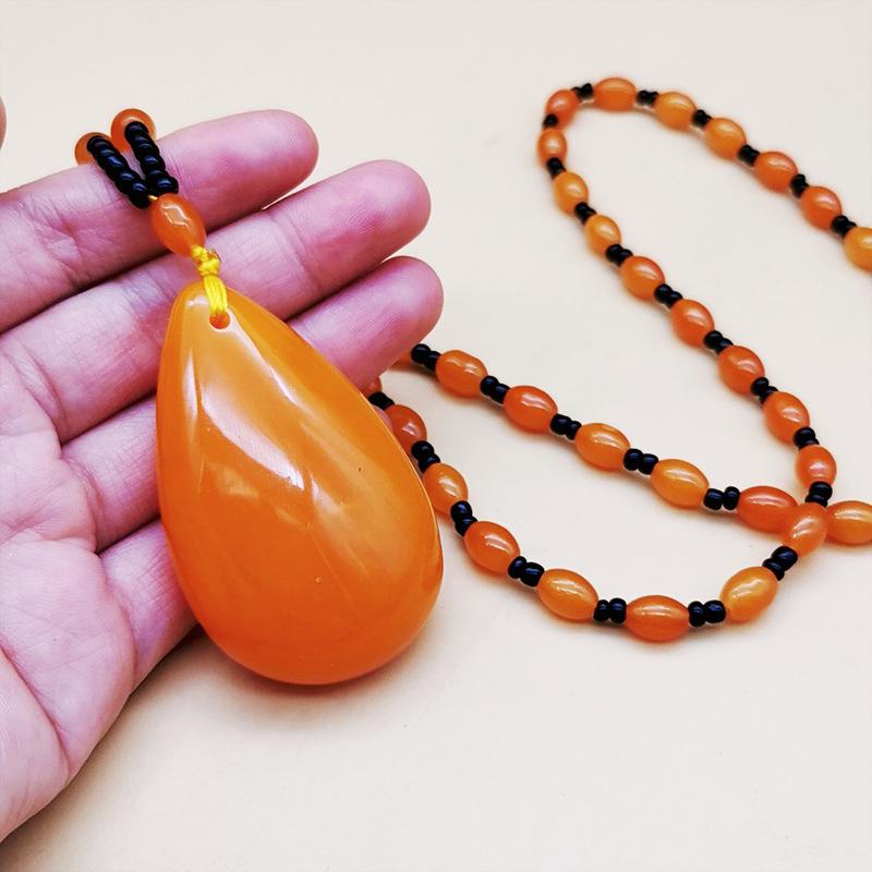 second generation orange beeswax necklace water drop pendant sweater chain live broadcast gift artistic retro yellow chicken grease amber pendant details Picture