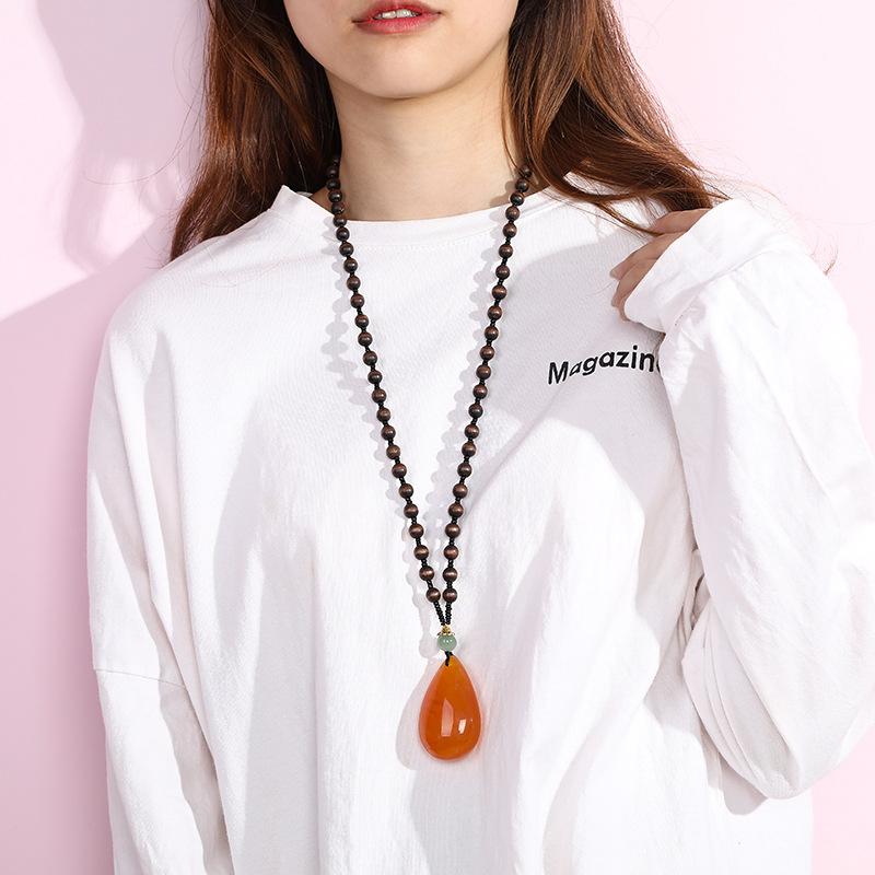yiwu accessories wholesale ethnic style imitation beeswax water drop necklace core wooden bead long sweater chain women's imitation amber pendant Specification drawing