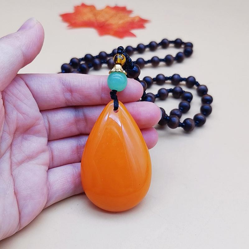 second generation orange beeswax necklace water drop pendant sweater chain live broadcast gift artistic retro yellow chicken grease amber pendant Specification drawing