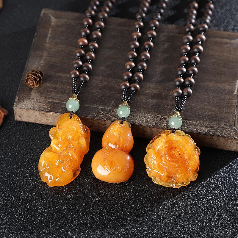 yiwu accessories wholesale ethnic style imitation beeswax water drop necklace core wooden bead long sweater chain women's imitation amber pendant Application Scenario