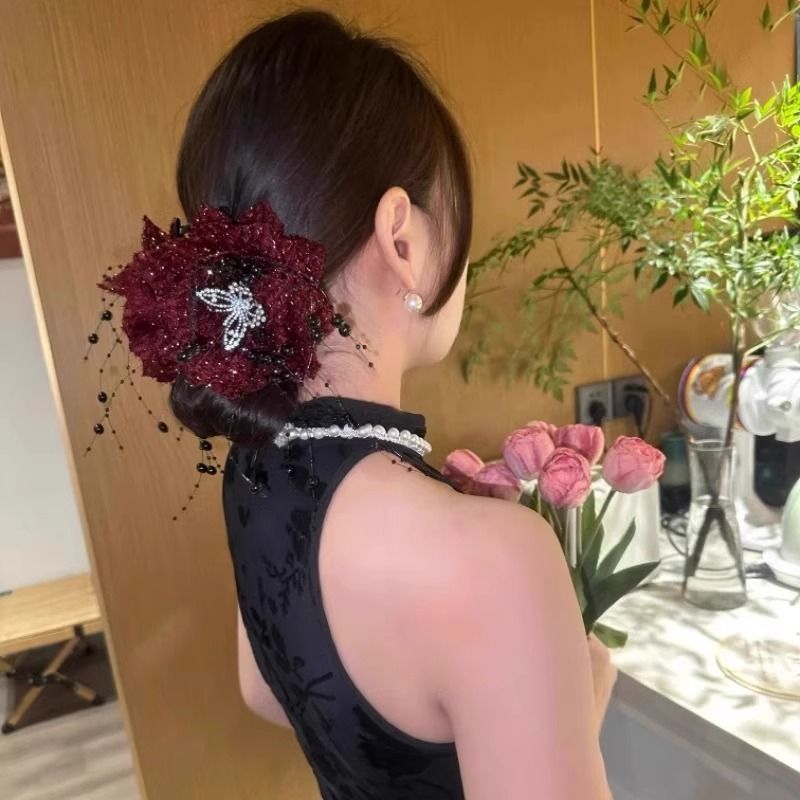 A new Korean-style, retro, versatile and fashionable headpiece with bright silk, flower, butterfly, tassel, shark, and a large hairpin at the back of the head details Picture