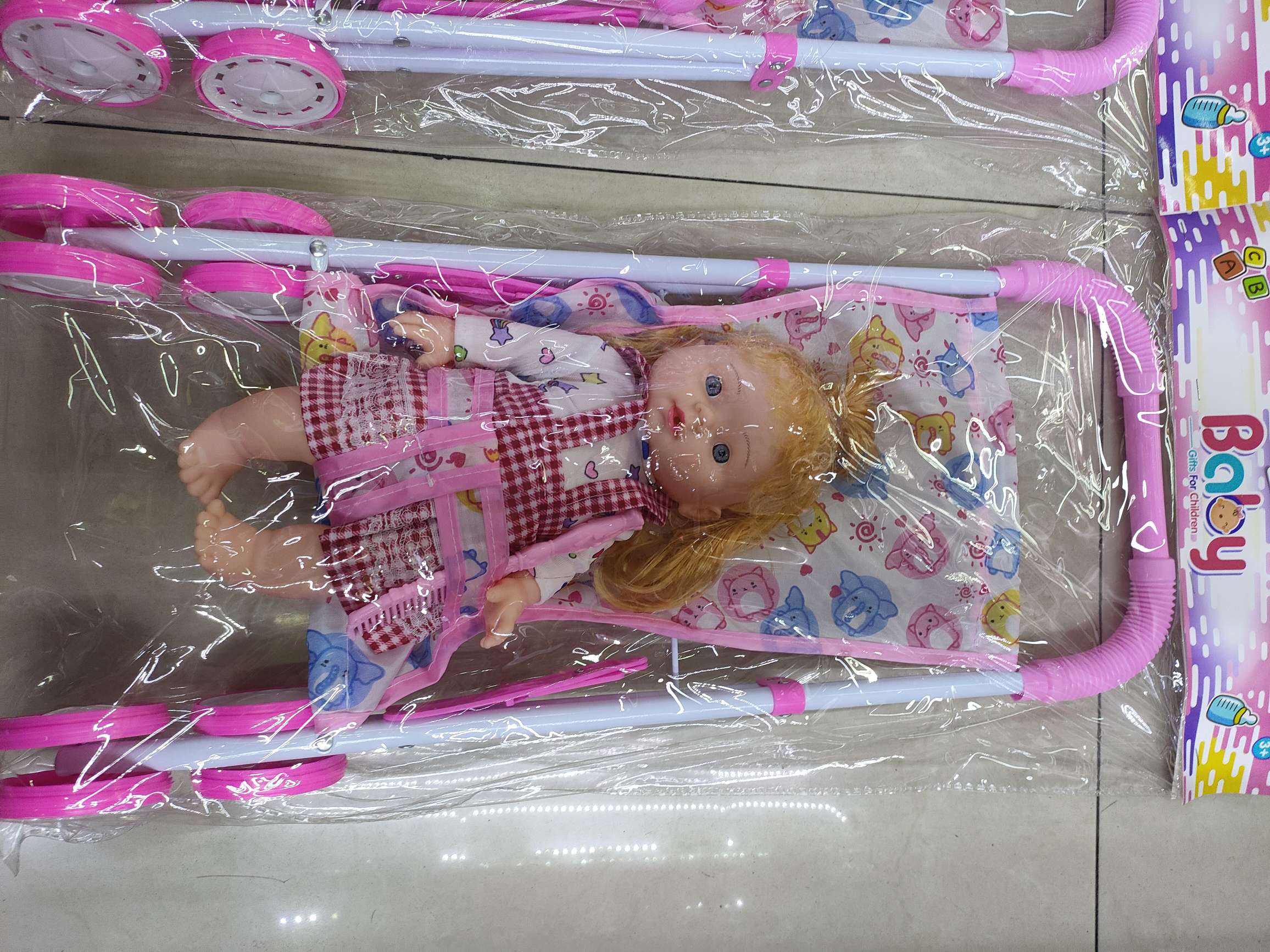 新款娃娃推车套装，男孩女孩两款混装，卡头袋包装。26元/套，36套/箱。娃娃推车新款热销详情图3