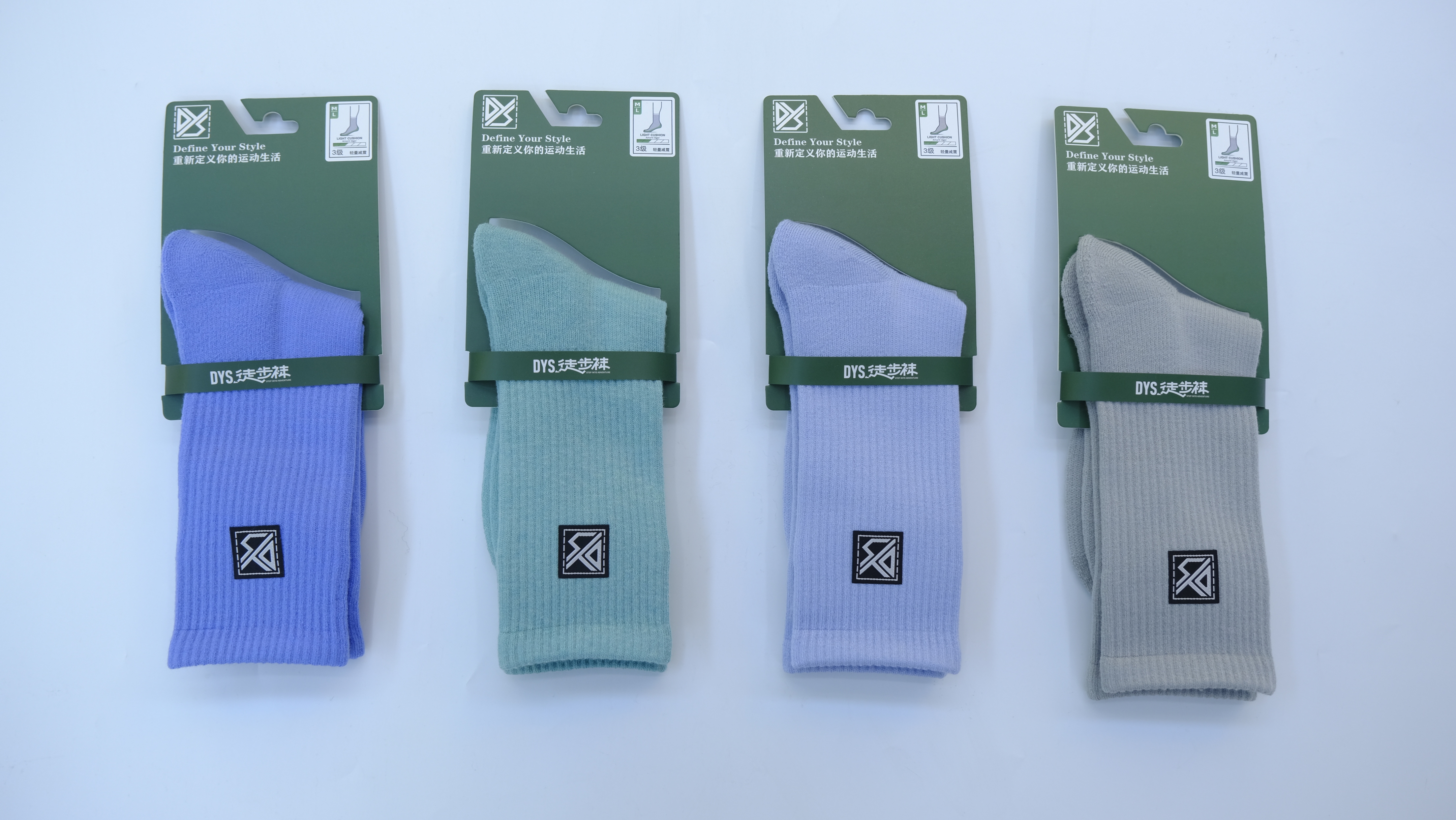 Close-up of textured knit pattern and colorful gradient dye on wool hiking sock