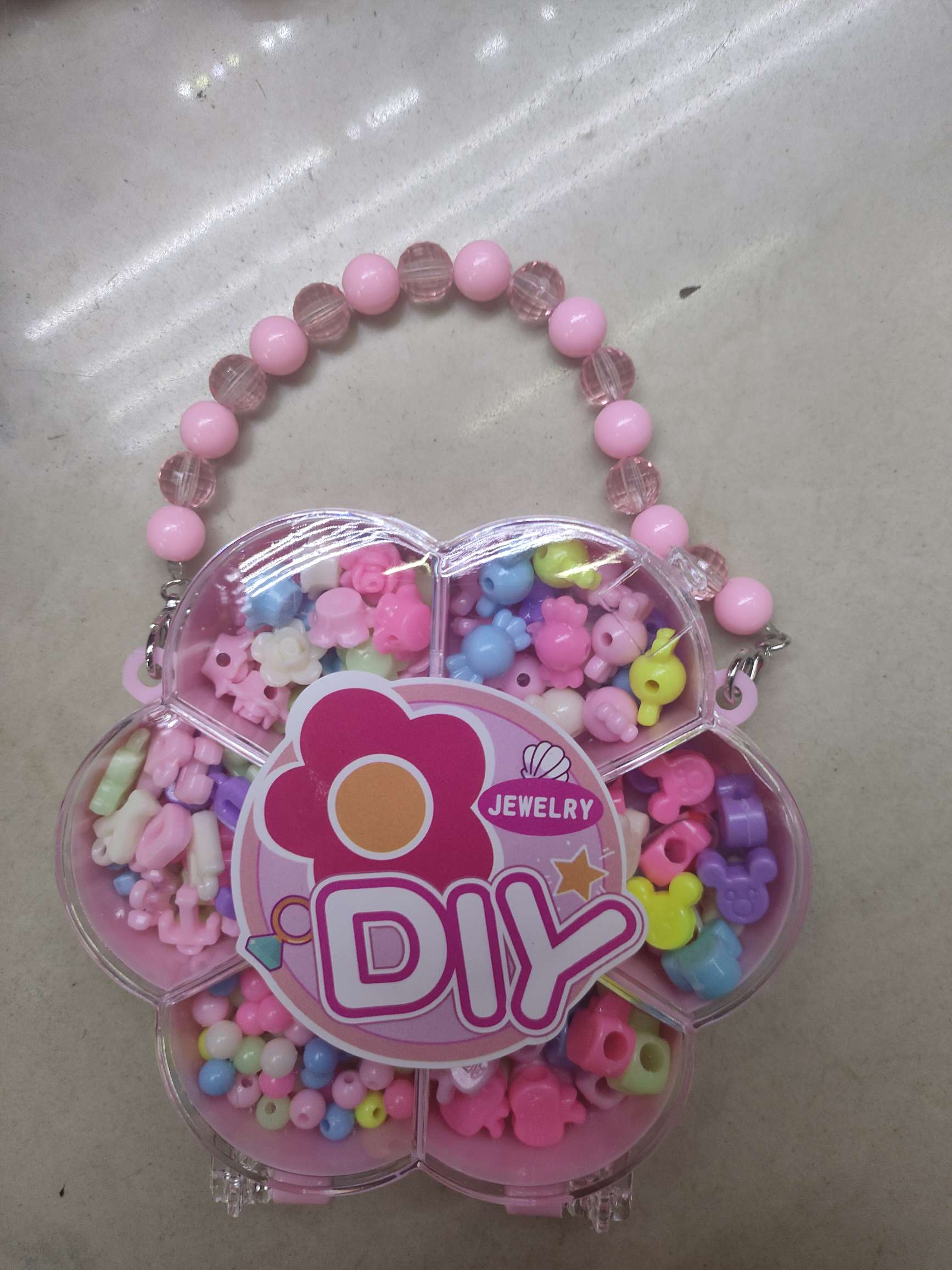 五角星/花朵/爱心串珠玩具盒提包,3款清装不混装.5.05元/个，12个/盒，18盒(216个)/箱。新款热销高档玩具产品图