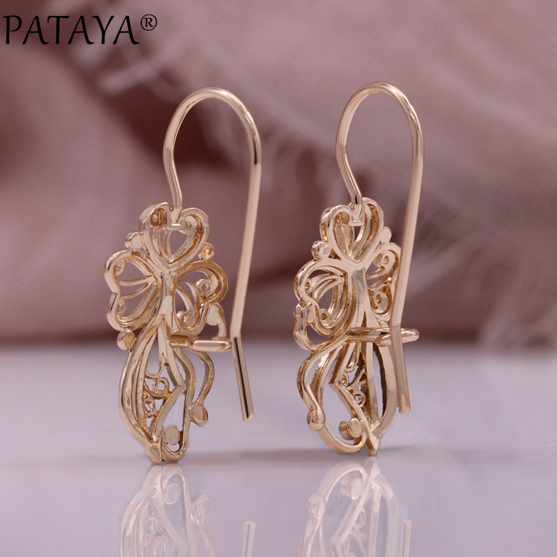 Factory direct supply of cross-border European and American women's ear hooks, fashionable and creative exaggerated accessories, rose golden surface spherical hollowed-out earrings. Factory direct supply wholesale Application Scenario
