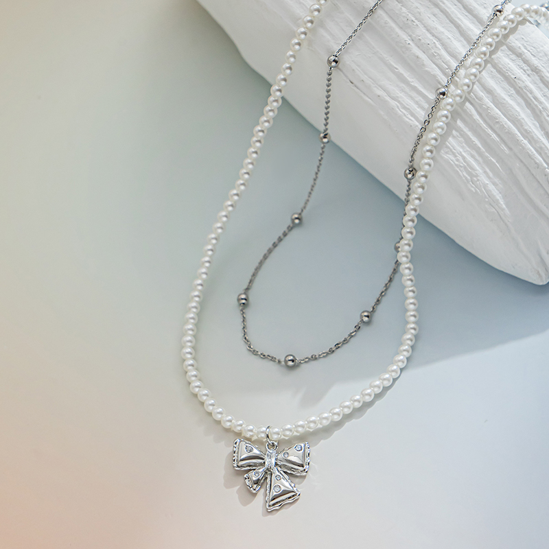 A bow pendant with pearls stacked on top of each other is an elegant and high-end pearl beaded necklace Specification image
