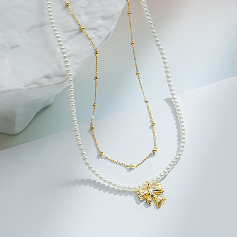 Bow pendant stacked pearl necklace, elegant and high-end pearl string necklace