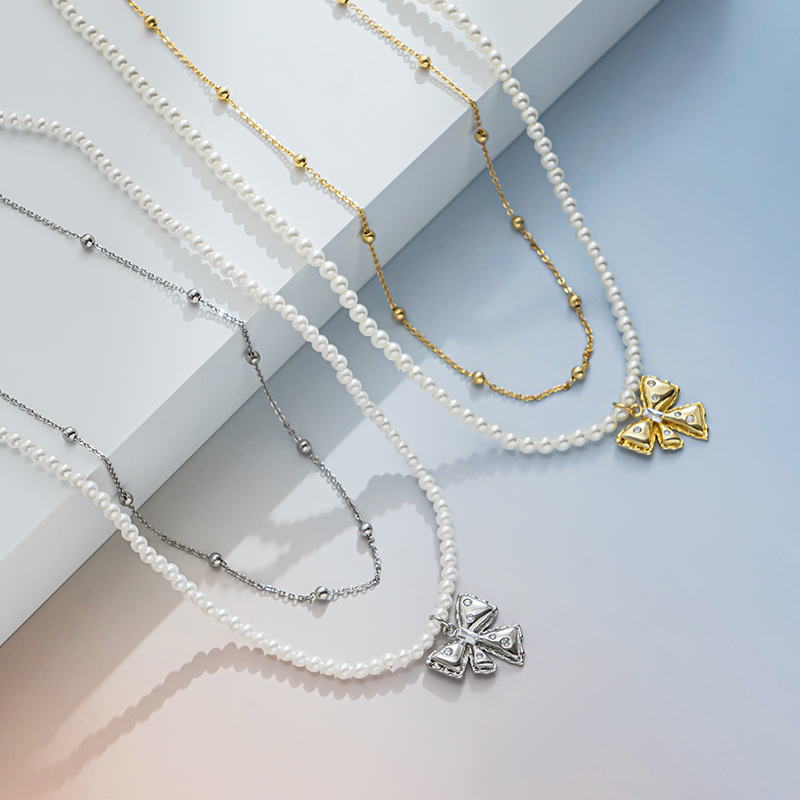 A bow pendant with pearls stacked on top of each other is an elegant and high-end pearl beaded necklace Item Picture