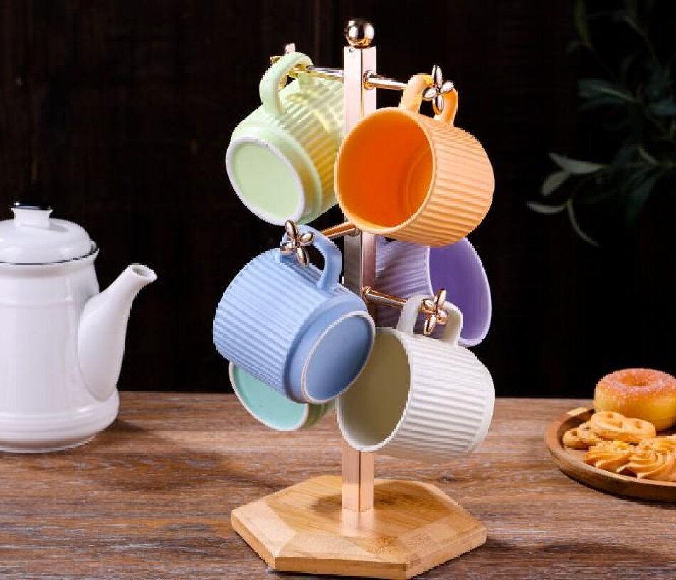 A mug holder with a hexagonal wooden base in the natural color of bamboo and gold Specification image