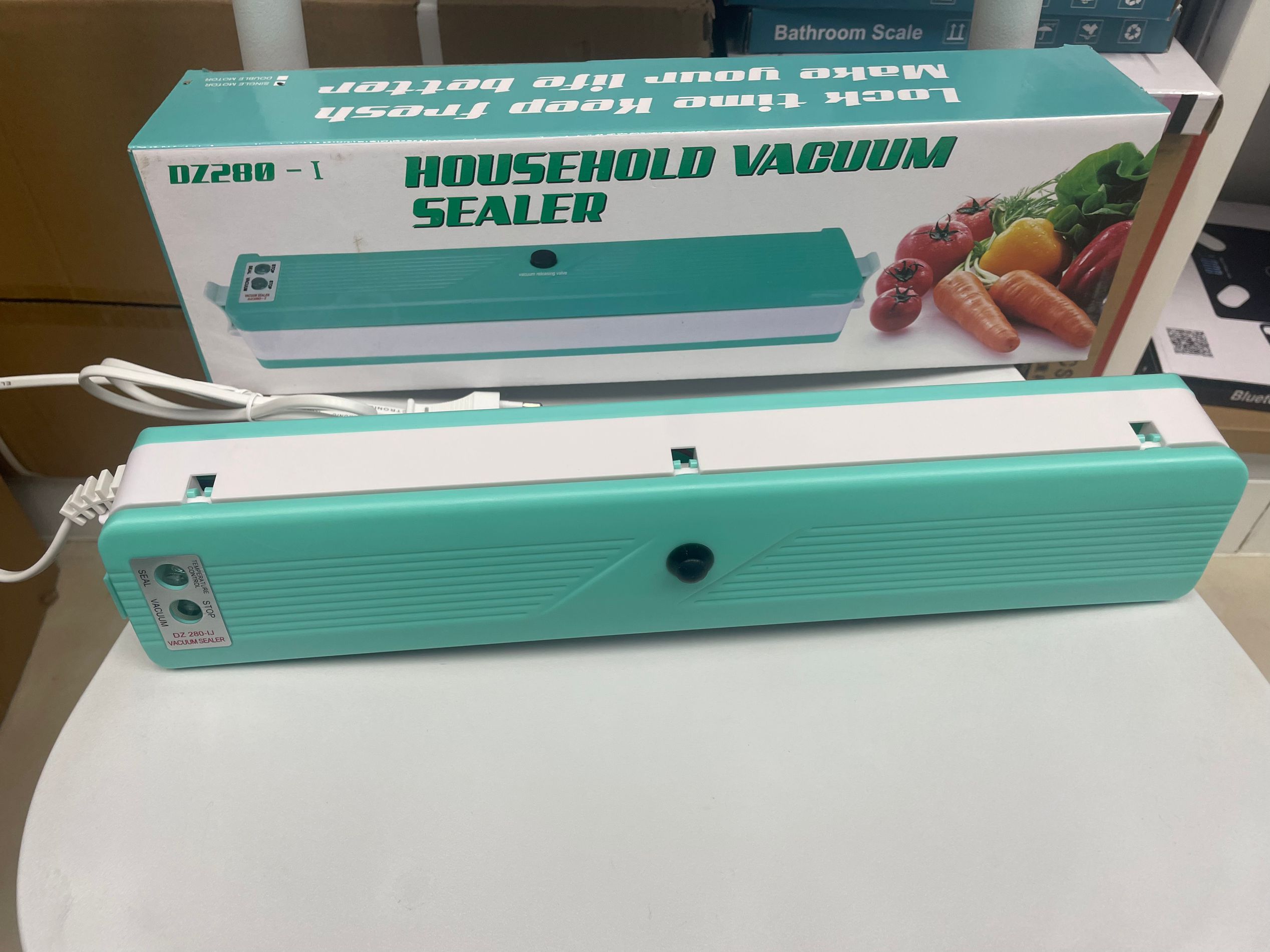 Máquina de sellado al vacío máquina de plastificación automática para el hogar máquina de envasado de alimentos máquina de sellado de snacks gadgets pequeña máquina de preservación de vacío fresco
