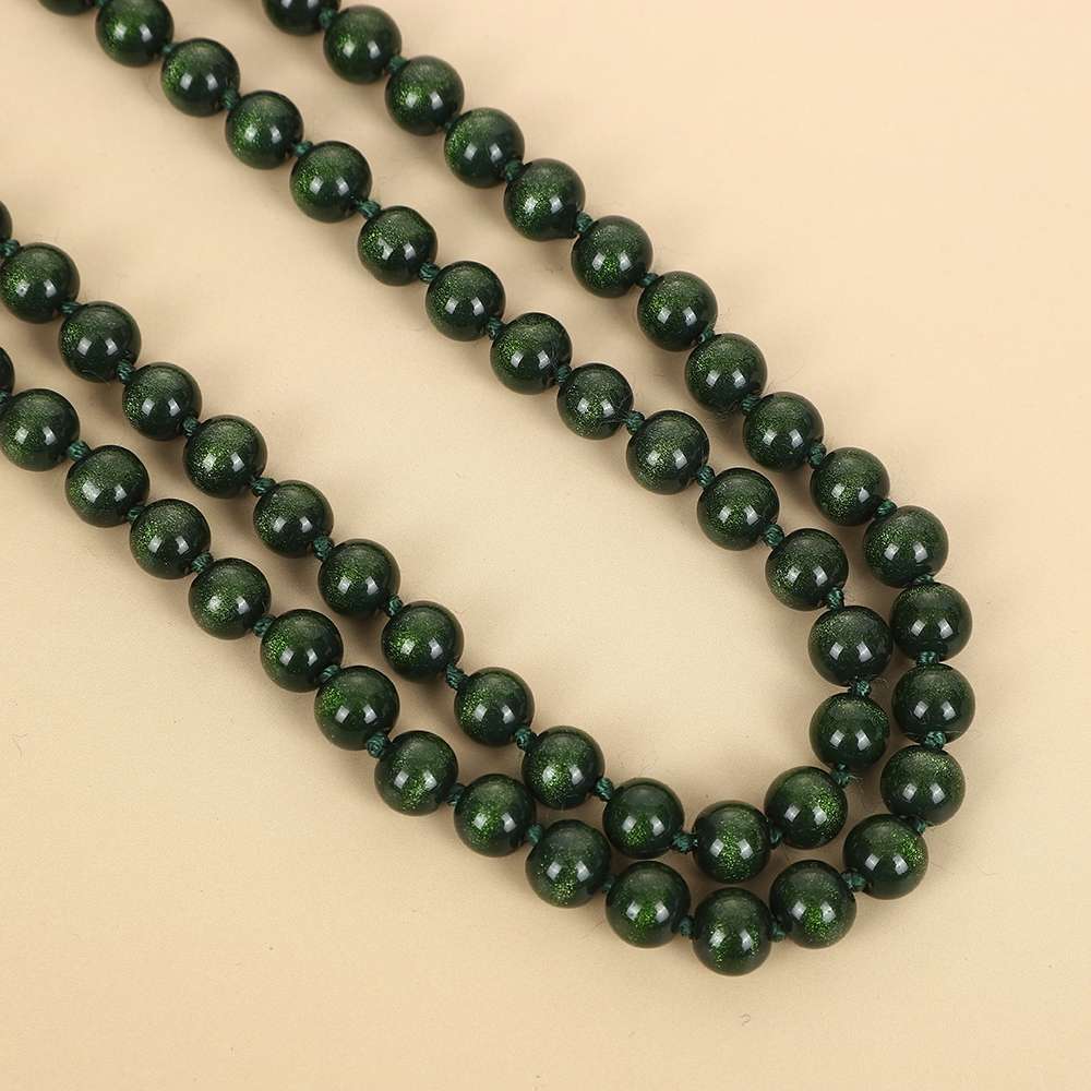 New imitation cat's eye green sand gold women's knotted necklace, multi-layered long sweater chain, clothing women's accessories wholesale necklace Application Scenario