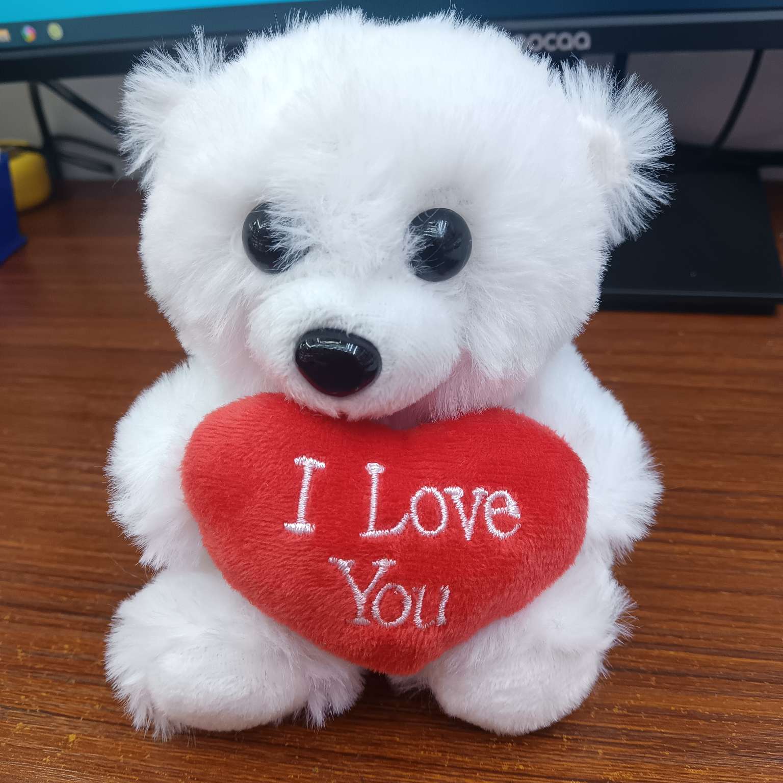 A white heart-hugging bear on Valentine's Day details Picture