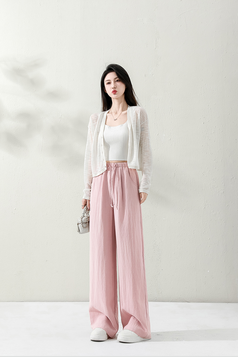 Tencel linen fashion casual pants are made of high-quality fabric, featuring a simple and fashionable design. The elastic belt design makes them versatile for various casual occasions details Picture