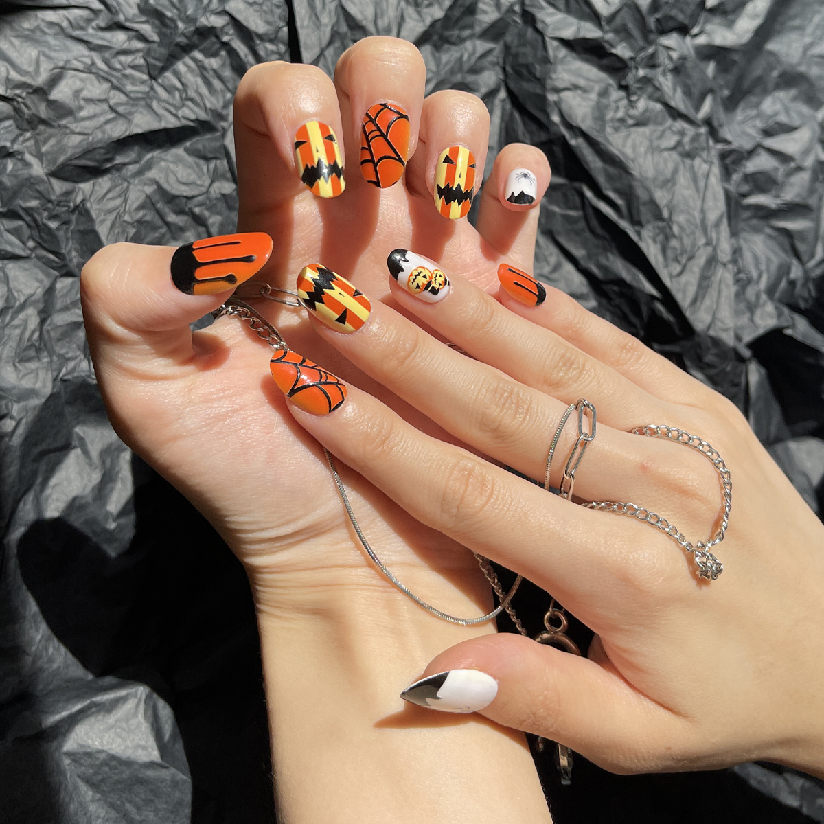 24 PCS PRESS ON NAIL TIPS OVAL SHAPE ORANGE BASE COLOR SPIDER WEB AND PUMPKIN PATTERN details Picture