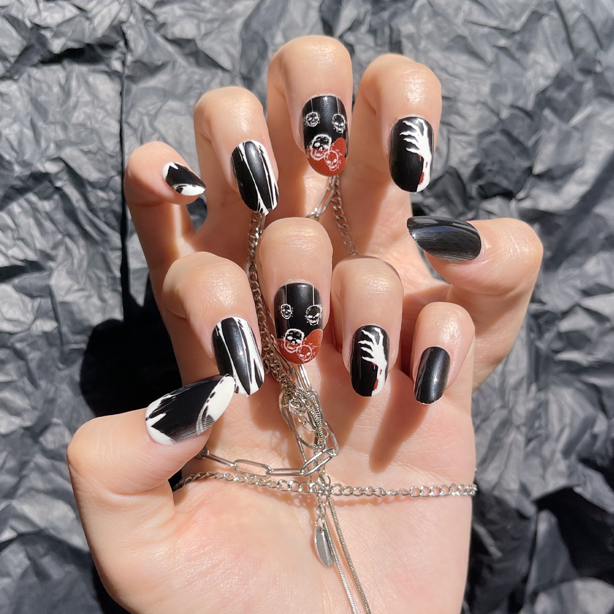 24 PCS PRESS ON NAIL TIPS OVAIL SHAPE BLACK BASE COLOR WITH SKULL PATTERN details Picture