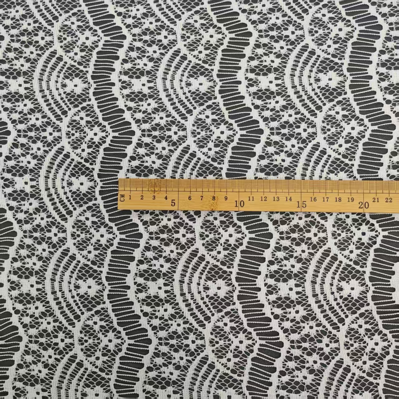 Spring and summer thin eyelash lace fabric beach blouse material, hollowed-out foreign trade clothing fabric, pure polyester non-elastic fabric pic 1