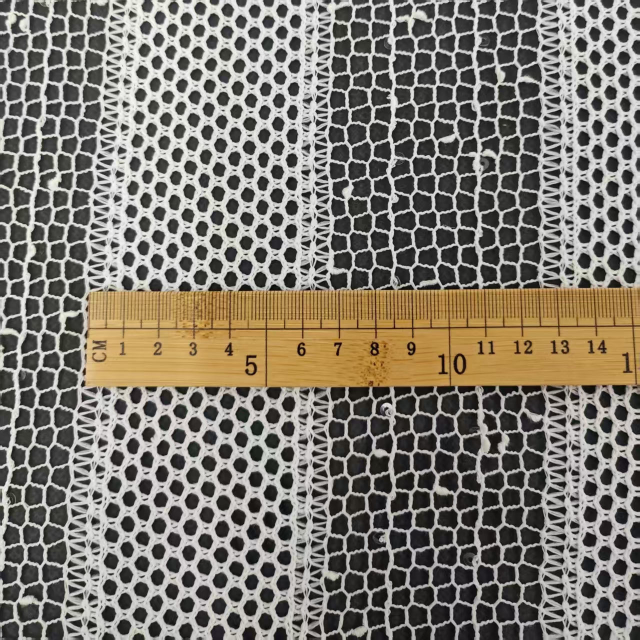 New polyester vertical stripe with sequined large mesh fabric, hollowed-out lightweight clothing fabric material, fashionable clothing shawl and scarf accessory fabric Specification image