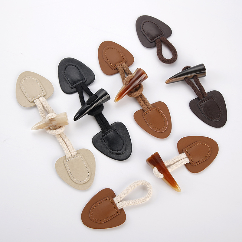 现货仿牛角皮对扣 羊角树脂纽扣 大衣风衣搭扣外套棉绳皮扣批