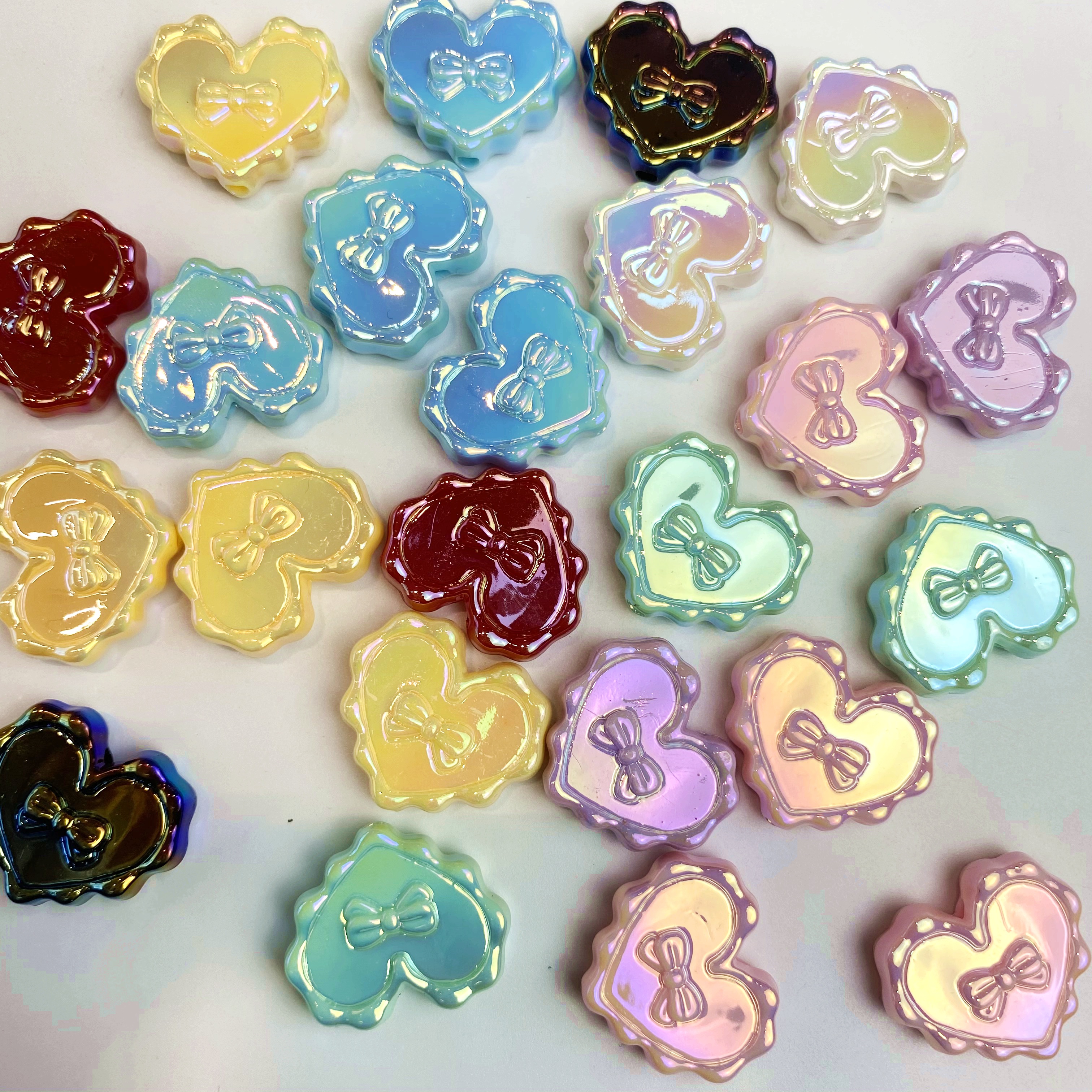 Acrylic uv cute, simple and fashionable heart-shaped bow diy mobile phone pendant/accessory material mixed color material Application Scenario