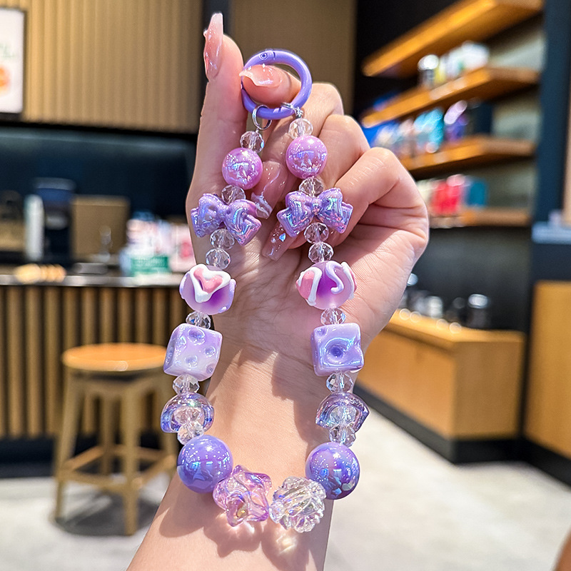 新款蝴蝶结奶酪串珠手机链女生手串挂饰汽车钥匙链包包挂件小礼品 手机链女短款时尚白底实物图