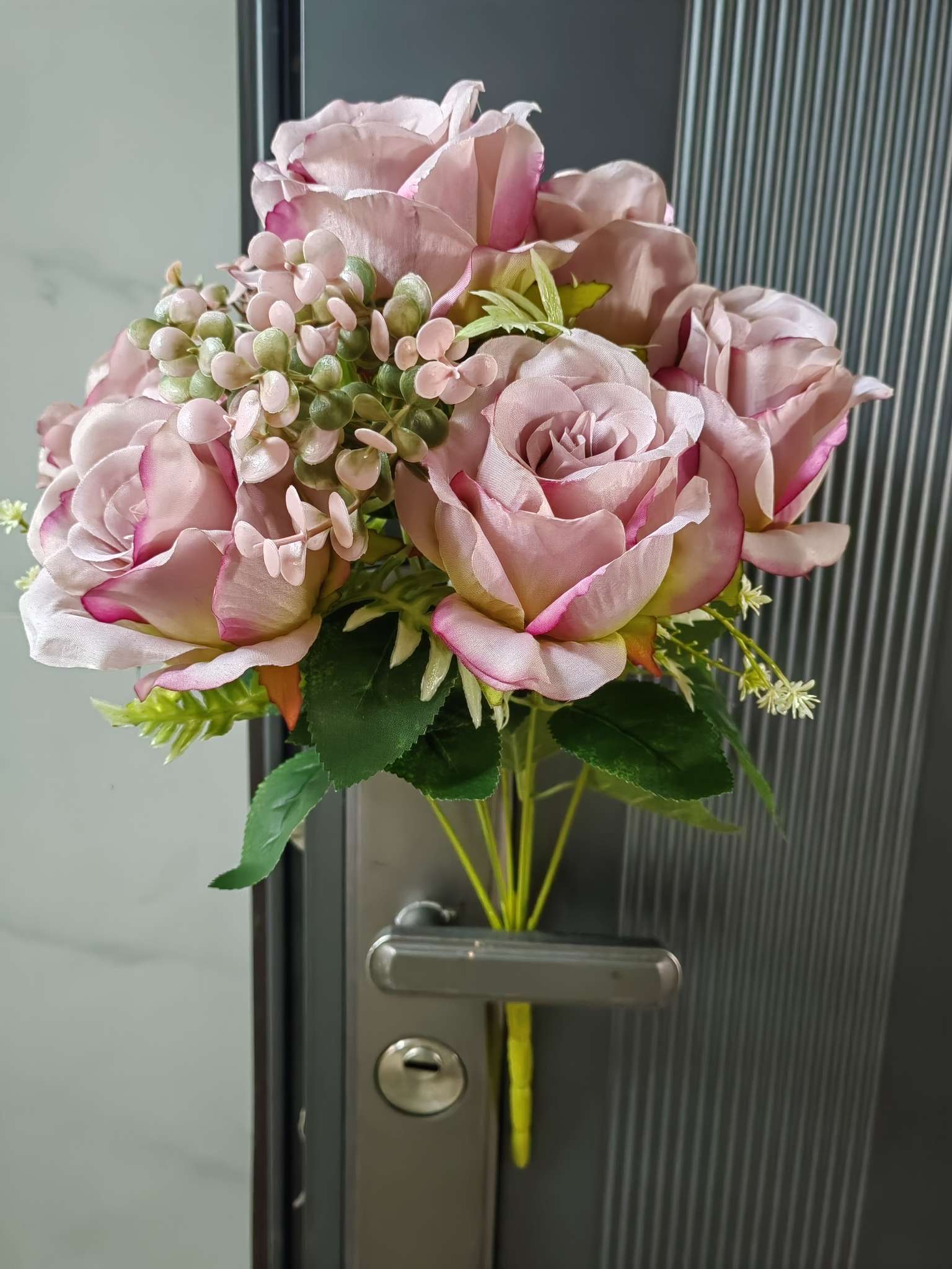 A bouquet of large roses and eucalyptus leaves details Picture