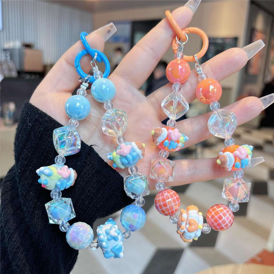 New creative beaded hand-painted dance beads, keychains, mobile phone lanyards, pendants, headphones, bags, bags, hanging decorations, best-selling batch of mobile phone chains, short styles for women, European and American style Specification image