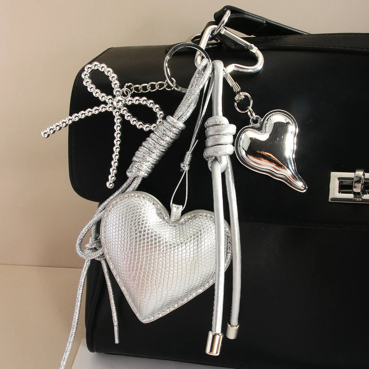 miu series original high-end silver pu heart-shaped bow woven rope bag pendant, keychain all-purpose pendant detail image 4