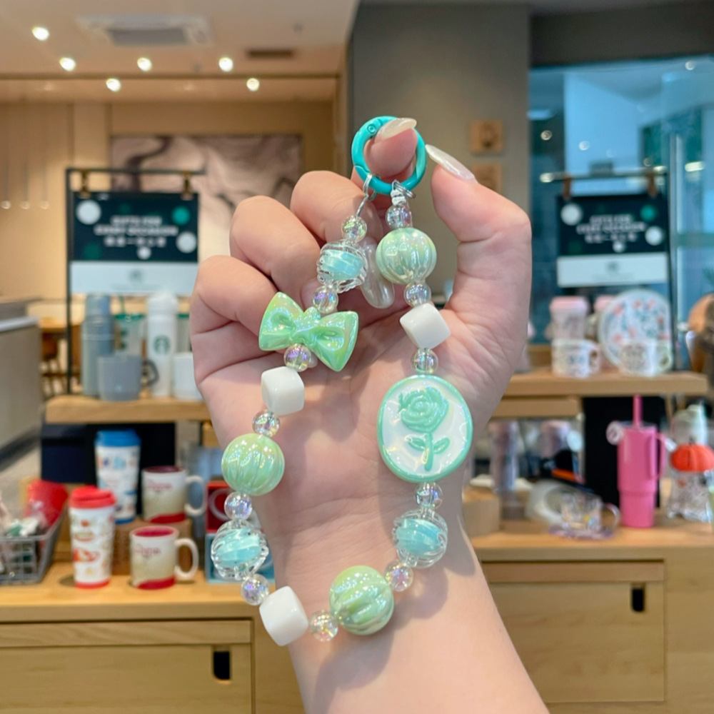 New oil-dripping rose chip mobile phone chain pendant, pumpkin bead beaded camera chain, keychain, bag, mobile phone pendant, women's short style, European and American Application Scenario