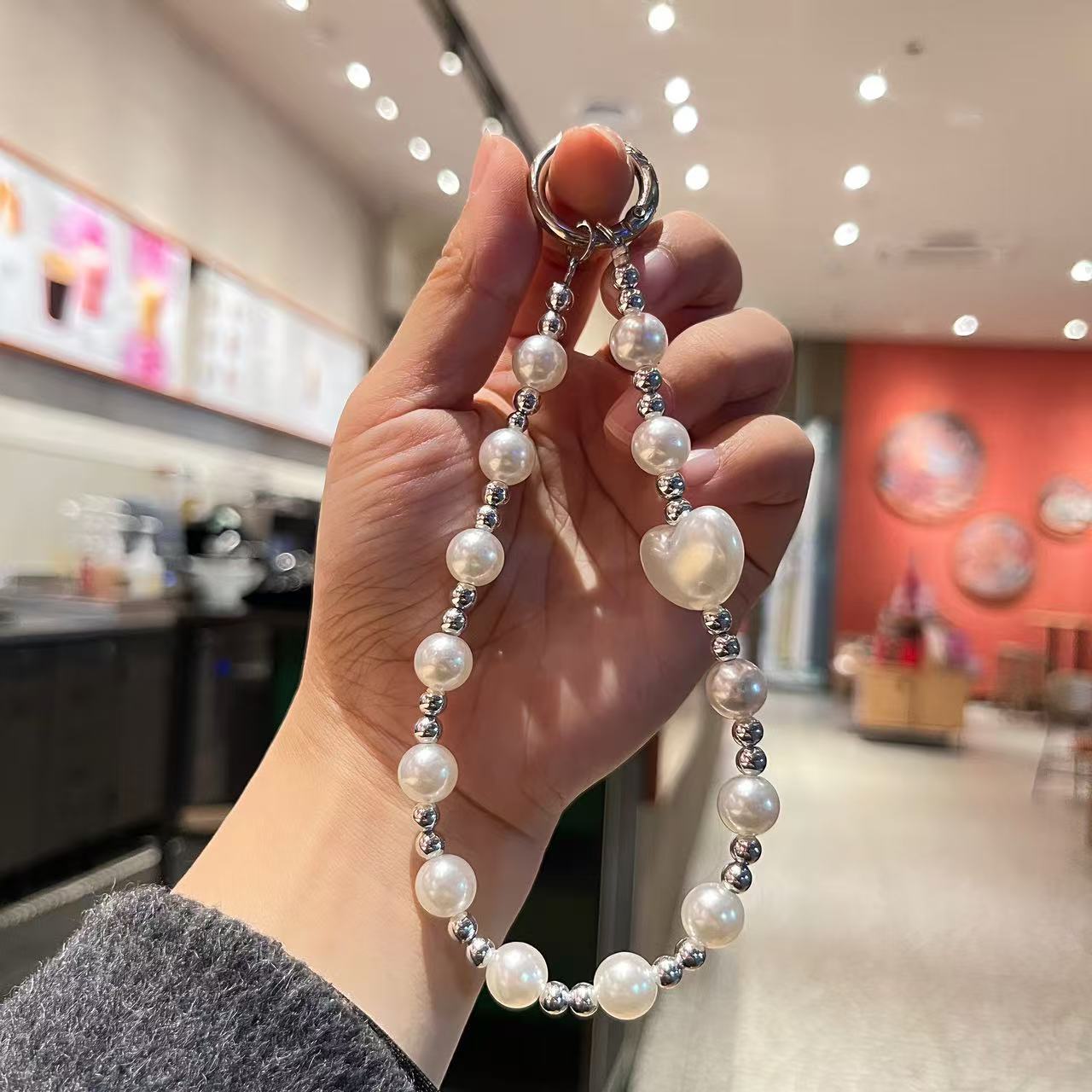 Creative imitation pearl meteor five-pointed star mobile phone chain lanyard, short wrist handcrafted beaded key chain for Japanese and Korean women detail image 5