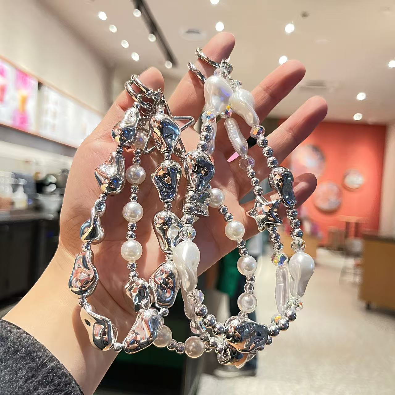 Creative imitation pearl meteor five-pointed star mobile phone chain lanyard, short wrist handcrafted beaded key chain for Japanese and Korean women