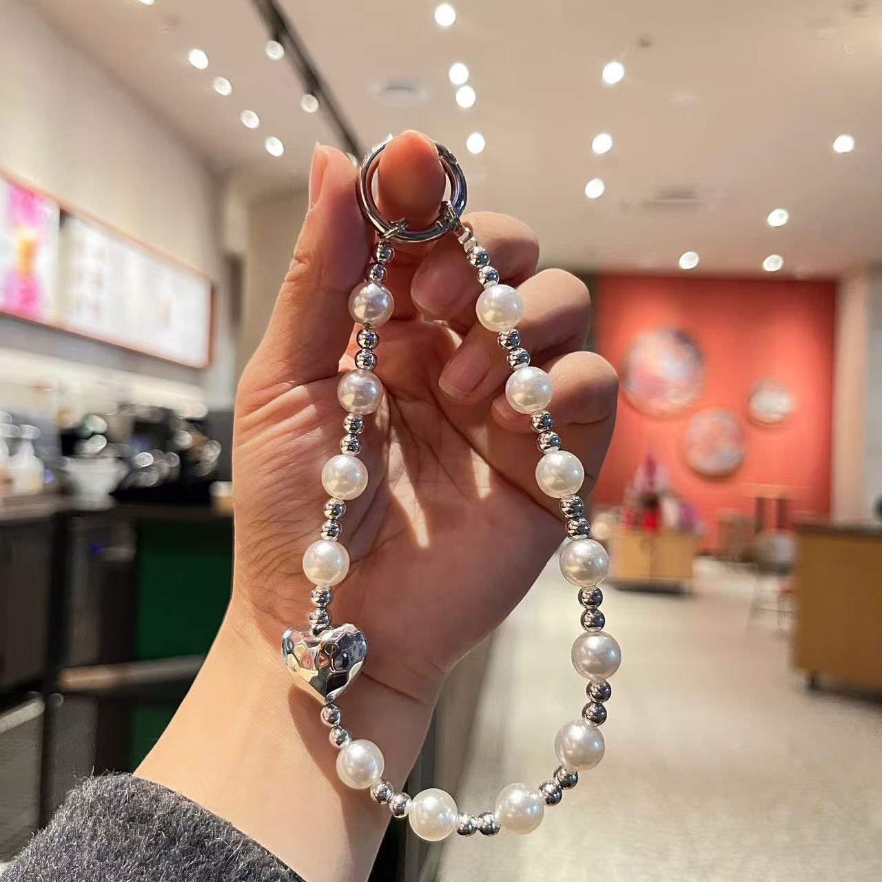 Creative imitation pearl meteor five-pointed star mobile phone chain lanyard, short wrist handcrafted beaded key chain for Japanese and Korean women detail image 3