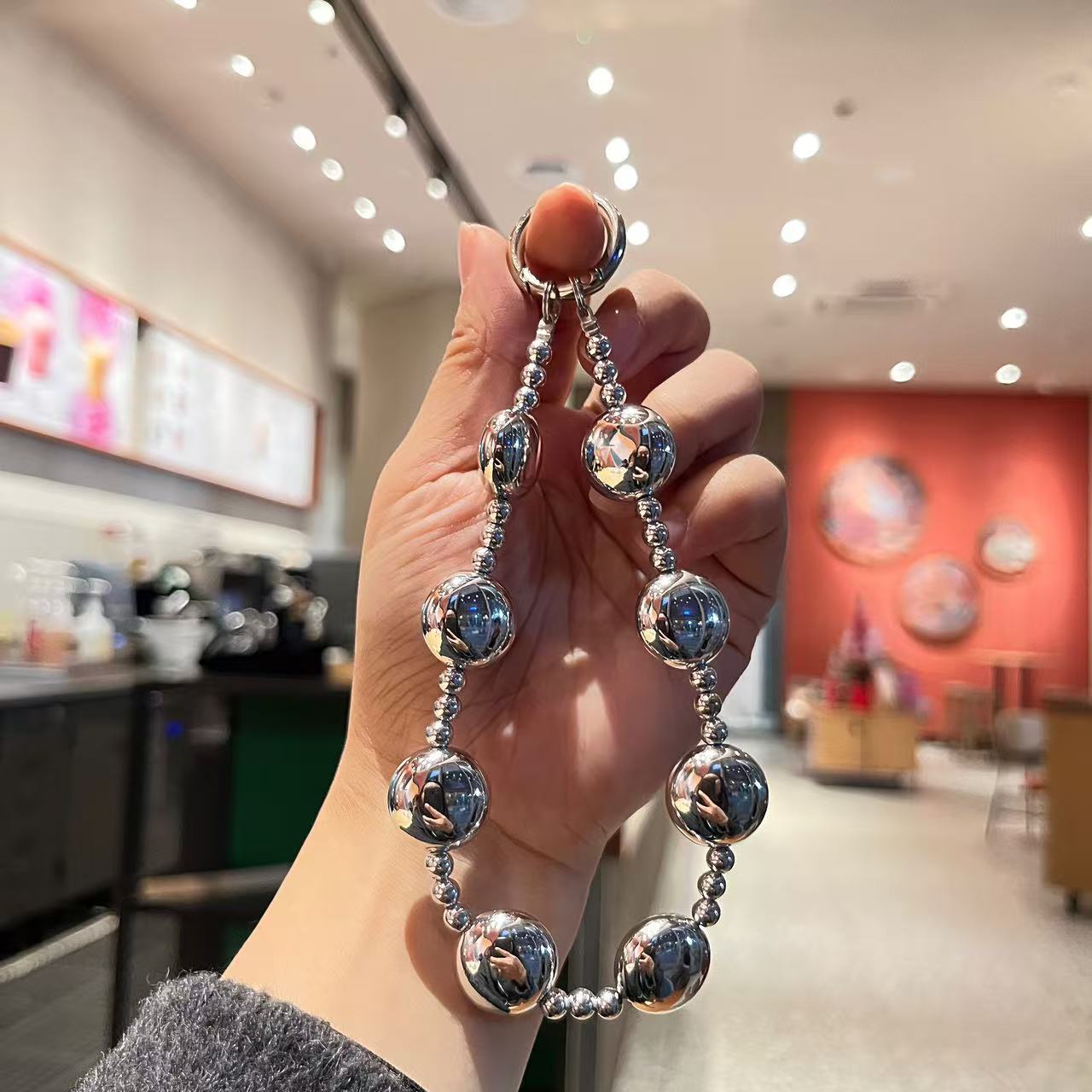 Creative imitation pearl meteor five-pointed star mobile phone chain lanyard, short wrist handcrafted beaded key chain for Japanese and Korean women Item Picture