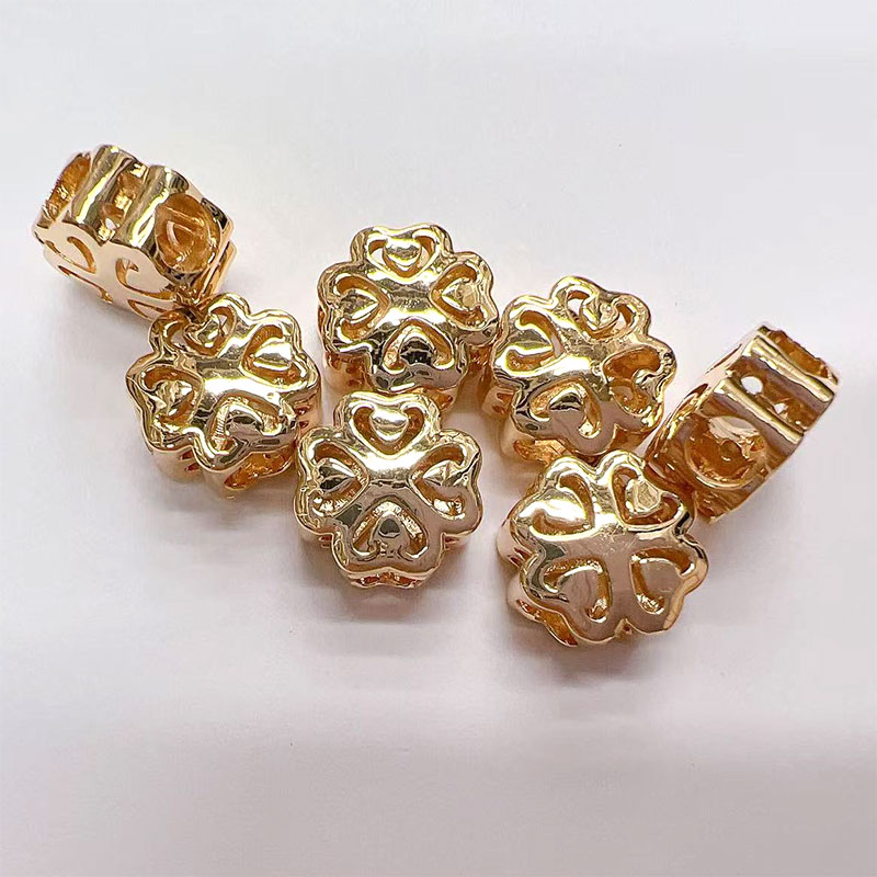 Copper plated with real gold, four-leaf flower, double-sided hollowed-out beads, DIY woven horizontal hole bracelet, necklace, loose beads and string beads accessories Specification image