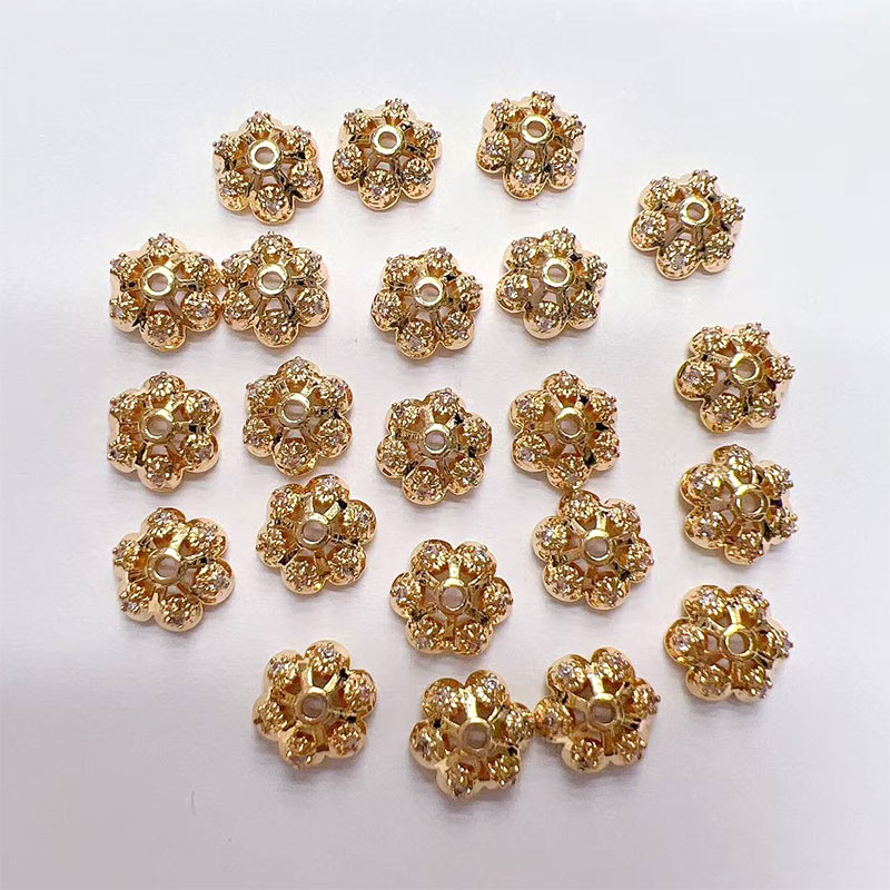 Jewelry accessories: Separators, flower caps, scattered beads, hand-strung beads, color-preserving copper plated with real gold, slightly inlaid zircon flower trays, snowflakes