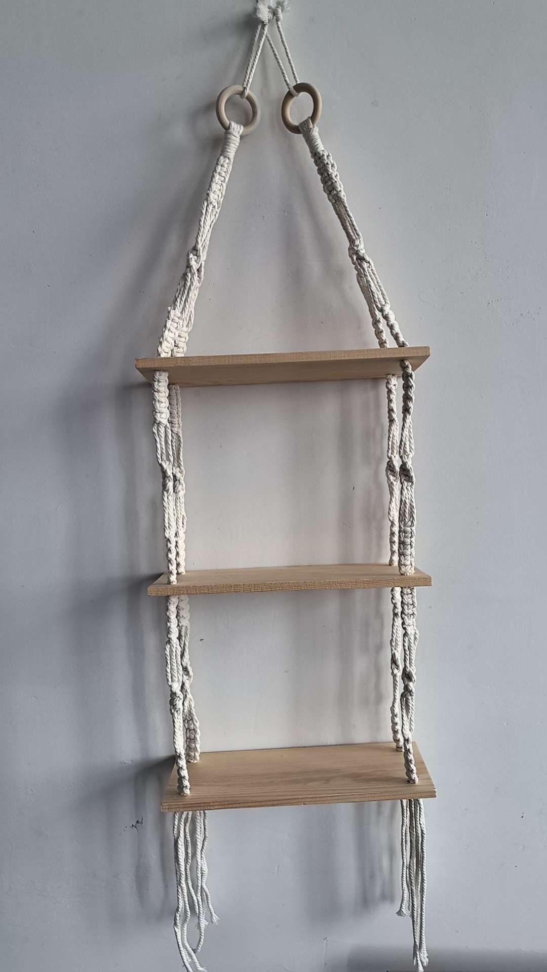 Cotton rope woven storage rack, hand-woven, can be used for decoration and storage. It is a popular storage rack for homestays, hotels and home furnishings. It is made of single-layer and double-layer raw wood and can hold plants. It can also bear weight detail image 3